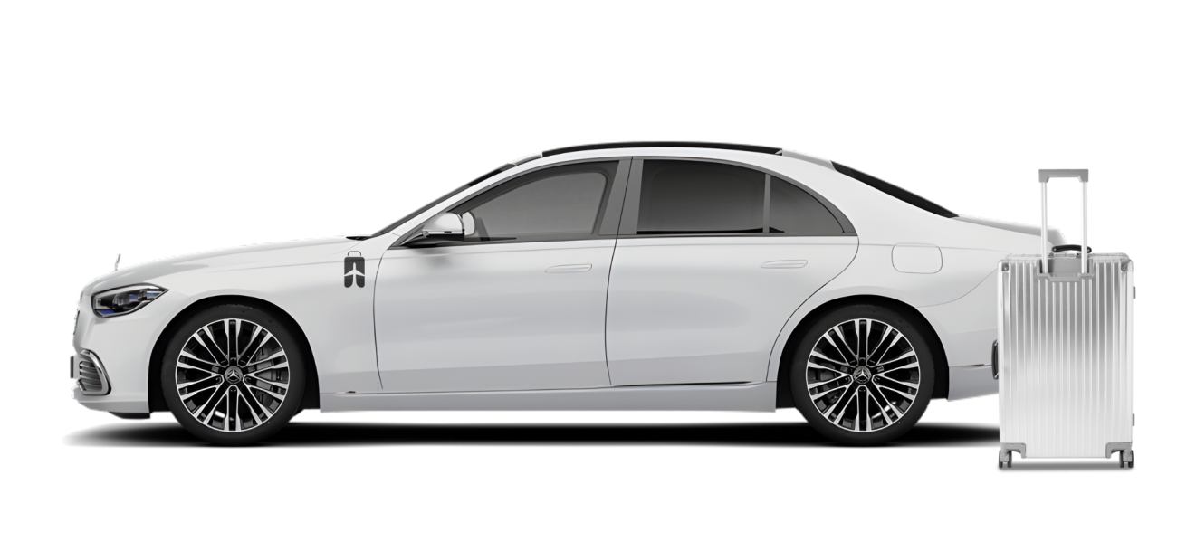 White Mercedes Benz luxury sedan with luggage ready for premium airport transfer and Executive Chauffeur Service In Malaysia
